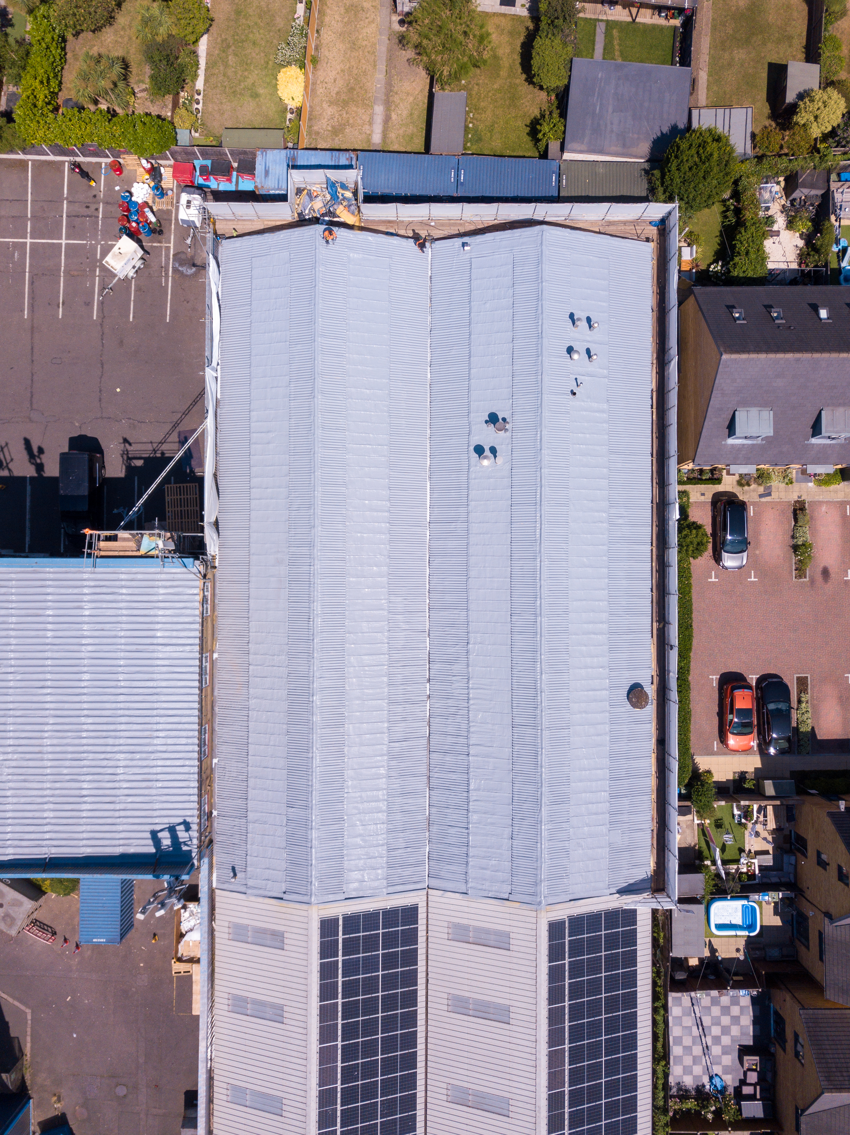 Aerial drone view of an asbestos roof fully coated with GacoFlex S42 silicone