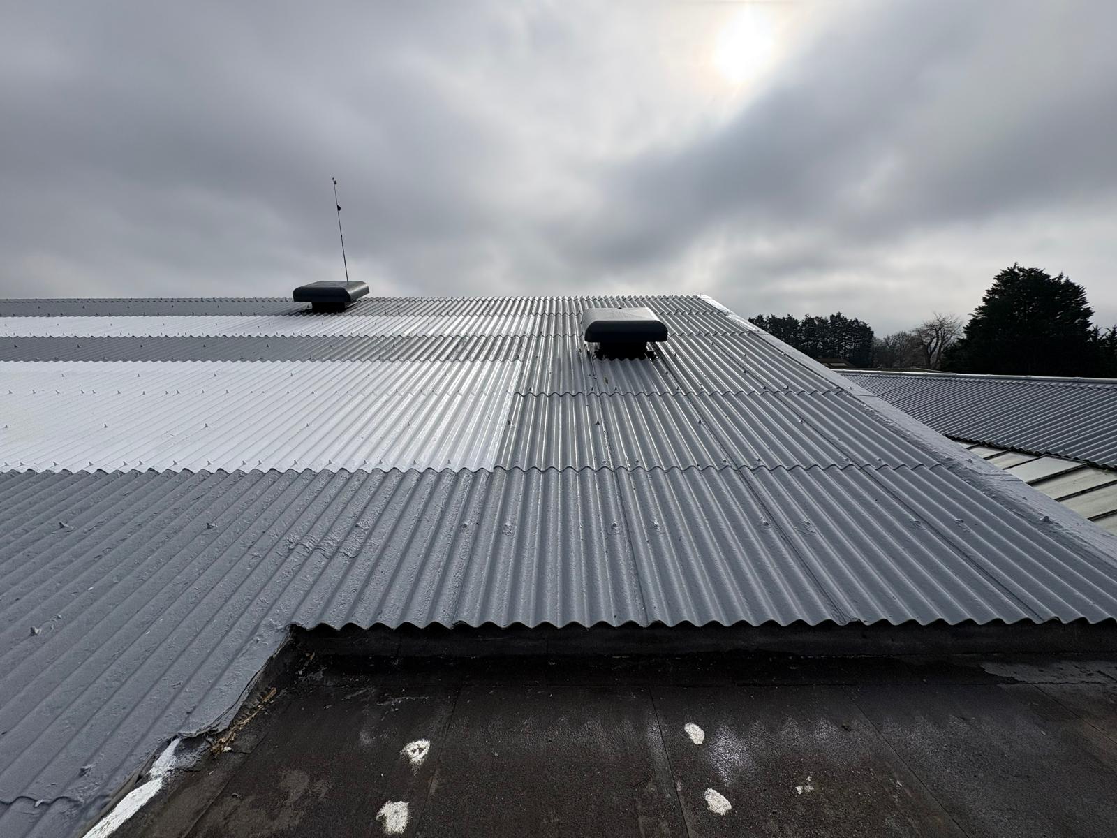 A commercial roof after coating with dark grey GacoFlex silicone